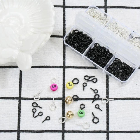 Must Have 300Pcs Small Screw Eye Pins For Jewelry Making And DIY Crafts in silver and black with bead and charm accessories on grid background