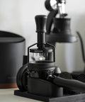 Top Shelf 58mm Espresso WDT Tool Featuring 16 Concentric Needles And Rock Solid Magnetic Base For Hella Even Puck Distribution Adjustable Depth Coffee Needle Stirrer Totally Nailing Shots Daily on a black base.