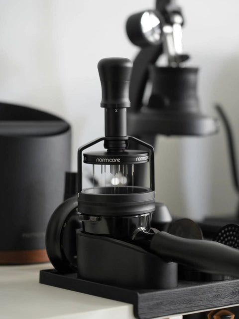 Top Shelf 58mm Espresso WDT Tool Featuring 16 Concentric Needles And Rock Solid Magnetic Base For Hella Even Puck Distribution Adjustable Depth Coffee Needle Stirrer Totally Nailing Shots Daily on a black base.