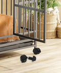 360 Degree Black Caster Wheels For Pet Cages Silent Rotating Casters With Locking Feature placed on hardwood floor next to metal pet cage