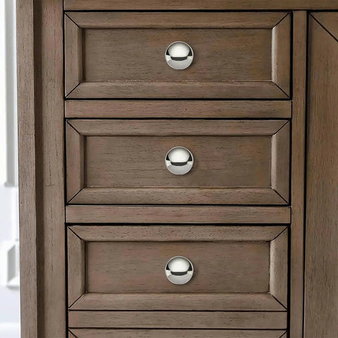 Two Pack One Half Inch Bifold Closet Door Knobs Polished Nickel Zinc Alloy Cabinet Handles on wooden drawers.