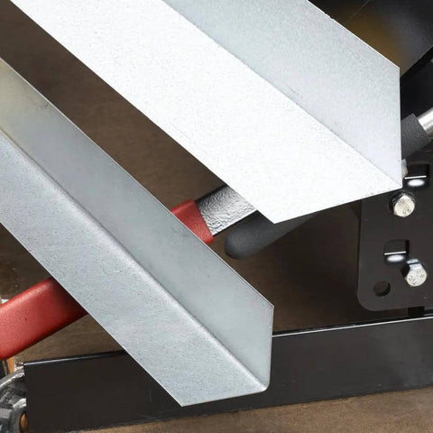 Close-up of MB48B 48 Inch Pan Style Mini Brake forming 135-degree bends in 22 gauge galvanized steel on a bench