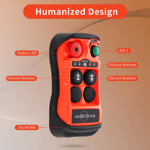 Orange wireless overhead crane remote controller with silicone buttons and status LEDs (front view)