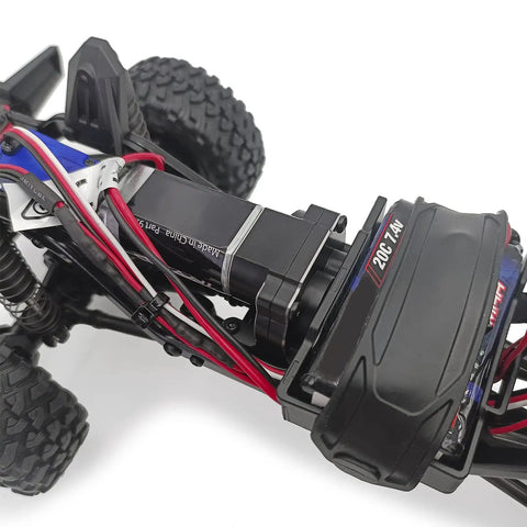 Close-up of Aluminum Transmission Case For 1/18 TRX4M RC Crawler, 16.6 To 1 Gearbox With Gear, installed on crawler model.
