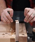 User applying Top Shelf High Carbon Steel Rectangle Card Scraper Set on wood for fine finishing work.