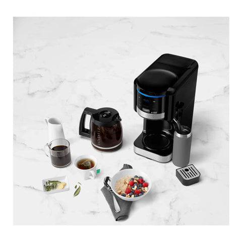 12 Cup Programmable Coffee Maker And Hot Water System with accessories on marble counter.