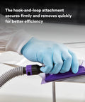 Gloved hand using Beast Fast Cutting Auto Sanding Roll With Pro Grade Multi Hole Dust Extraction on a surface.