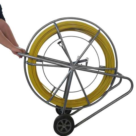 Heavy Duty Fiberglass Fish Tape Built Dang Solid For Hella Smooth Wire Routing And Conduit Pulling With Sturdy Wood Reel And Wheeled Cart 12mm 820Ft Length To Route Cables Anywhere Fast on a metal rolling cart.