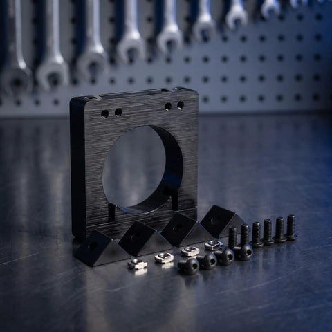 Industrial Grade 65mm Cnc Spindle Stabilizing Clamp Rack with accessories on a workbench, ideal for machinists and hobby shops.