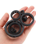 Hand holding 15 Pack Round Cable Snap Bushing Grommets One And Quarter Inch 32mm Black Snap In Cable Grommet Protectors