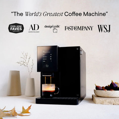 Front view of a black No Fuss Fully Automatic Espresso Machine With App Control And Auto Wake And Sleep For All Milk Types on a kitchen counter.