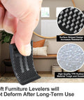 Close-up of a person holding a black rubber furniture leveler with striped design and TPR material, showing durability and resistance.
