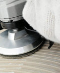 Close-up of Aluminum Backer Pad Set 4 Inch Hook and Loop Backing Pads 5/8-11 Arbor attached to sander in use