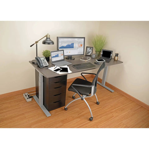 Home office setup with Isobar 8 Outlet Surge Protector Power Strip with 25 Foot Cord under desk, various electronics connected.