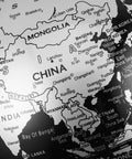 Close-up of Asian continent on 6 Inch World Globe With Antique Bronze Stand For Desktop Decor And Geography Learning Ideal For Home Office And Classroom Use Silver Finish