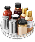 Compact Clear Acrylic Lazy Susan Organizer 8 Inch Turntable displaying spices and sauces, suitable for cabinets and countertops.