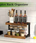 Two Tier Countertop Spice Rack Organizer In Rustic Brown Wood Finish with spices and bottles on kitchen counter.
