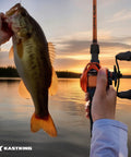 Angler holding bass and Lethal Blaze Baitcasting Fishing Reel With 7.3 To 1 Gear Ratio, low profile for freshwater fishing.