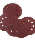 Super Tough 5 Inch Hook And Loop Sanding Discs With Eight Holes For Dustless Vibes stacked for surface conditioning tasks.
