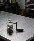 Awesome Plastic Hand Crank Manual Wire Stripper For Copper And Aluminum Cables on a metal table, features adjustable design for 2 to 20mm range.