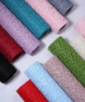 Array of colorful Pro Grade Flower Wrapping Mesh Paper For Bouquets, Irregular Hollow Net Wrapper, multiple rolls displayed.