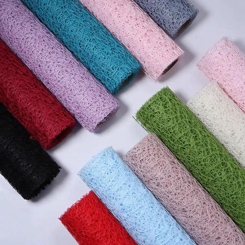 Array of colorful Pro Grade Flower Wrapping Mesh Paper For Bouquets, Irregular Hollow Net Wrapper, multiple rolls displayed.