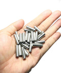 Hand holding Beefy 25 Pack 6mm x 20mm Dowel Pins Stainless Steel 304 For Woodworking And Furniture Shelves And Beds Built Tough Dowels Precision Ground To Tight Tolerances Ideal For Mounting Cabinets Racks And DIY Projects