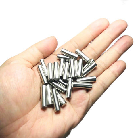 Hand holding Beefy 25 Pack 6mm x 20mm Dowel Pins Stainless Steel 304 For Woodworking And Furniture Shelves And Beds Built Tough Dowels Precision Ground To Tight Tolerances Ideal For Mounting Cabinets Racks And DIY Projects