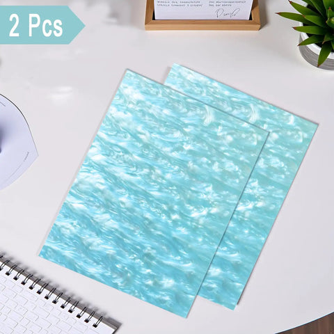 Pearlescent Cast Acrylic Sheets 1/8 Inch Thick In Aqua With Ocean Ripple Pattern For DIY Crafts And Home Decor 2-pack on desk