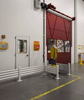 Industrial workplace with safety equipment and fire extinguisher instruction posters on wall, worker in yellow suit carrying briefcase.