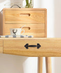 Vintage Cast Iron Cabinet Pulls And Drawer Handles For Kitchen And Furniture on light wood dresser, rustic style.