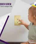 Elite Series Screwless Decorator Wall Plate in Brushed Gold 1 Gang 4.68 Inch H By 2.93 Inch L with child-safe design shown with child interacting
