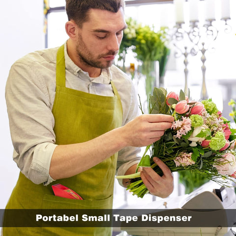 Florist in apron arranging flowers near clear noiseless packing tape with ergonomic dispenser on counter.