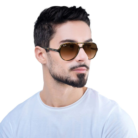 Man wearing RB4125 Cats 5000 Aviator Sunglasses Unisex Medium Fit 131mm Hinge To Hinge Light Havana Frames With Clear Gradient Brown Lenses