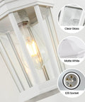 Close-up of large outdoor wall lantern light fixture for porch and exterior, matte white finish with clear glass panels and E26 socket