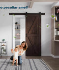 32 Inch By 84 Inch Brown Spruce Wood Barn Door With 5.5 Foot Hardware Track Kit Included Double Surface Easy Assembly K Frame Coffee Finish Sliding Barn Door For Modern Homes And Studios installed in a living room