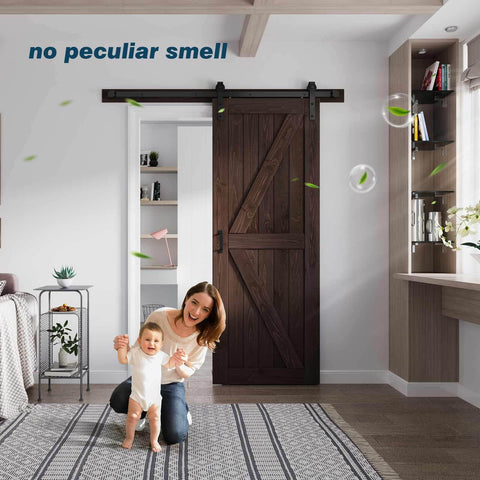 32 Inch By 84 Inch Brown Spruce Wood Barn Door With 5.5 Foot Hardware Track Kit Included Double Surface Easy Assembly K Frame Coffee Finish Sliding Barn Door For Modern Homes And Studios installed in a living room