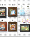20 Pack Black Pegboard Picture Hangers for One Eighth and One Quarter Inch Boards with U Shape Prong Design used on wall