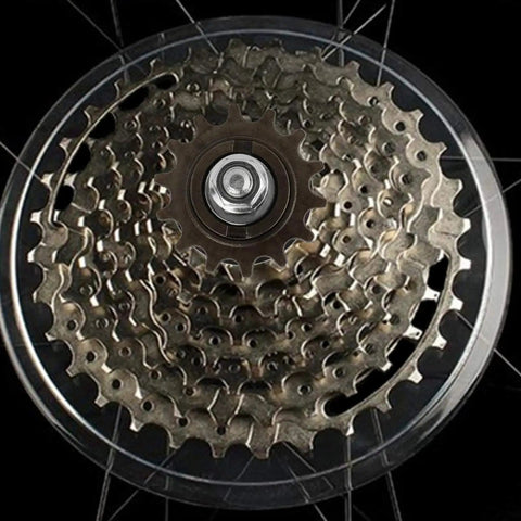 Close-up of Universal 36 Hole Rear Bike Hub With Solid Axle And 14T showing metal disc and spoke holes