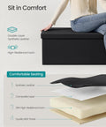 Woman sitting on Mazie Collection 43 Inch Folding Storage Ottoman Bench With Hidden Storage Foot Rest Stool Supports Up To 660 Lb No Fuss Easy Foldaway Design For Living Room Black Synthetic Leather with comfort layers displayed.