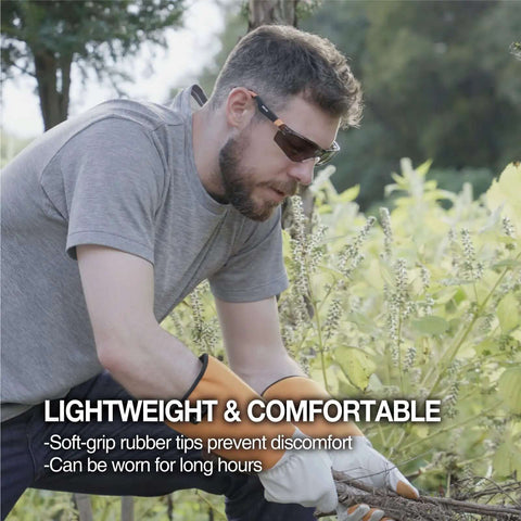 Man wearing Outdoor Safety Sunglasses For Work And Play With Smoke Lenses, UV 99.9 Percent Protection, doing garden work
