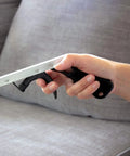 DMI reacher grabber tool with 32-inch silver shaft and black trigger-grip handle held in hand.