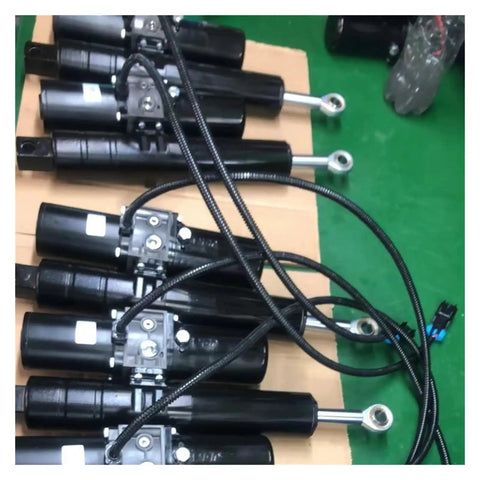 Heavy Duty Linear Actuator With 12V DC Electric 8000N Lift Force Rock Solid Design, multiple units laid flat with hydraulic lines.
