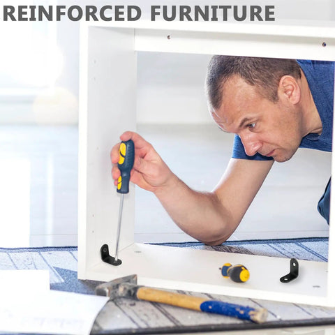 Man using screwdriver to install Tough As Nails 50 Pack Black Stainless Steel L Brackets And Corner Supports for furniture repair.