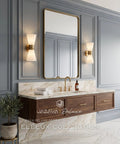 JAZAVA 2-Light Up Down Wall Sconce, Frosted Pleated Glass, Pale Brass in an elegant bathroom setting with a gold-framed mirror.