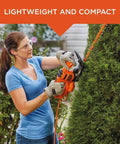 Woman using Corded 17 Inch Hedge Trimmer With 3.2 Amp Motor, Dual Action Blades For Reduced Vibration And Cleaner Cuts on bush