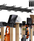 Wall Mounted Garage Tool Organizer Rack, 48 Inch Adjustable Heavy Duty Storage System holding rakes, shovels, and brooms