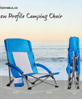 Low Profile Folding Beach Chair With Cup Holders And Carry Bag, featuring extra wide seat and high back, shown on a beach.