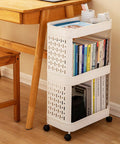 Hella Roomy Rolling Storage Organizer Cart With Smooth Plastic Shelves And Sturdy Rubber Wheels Sweet Beige Utility Shelf Rack for books beside a wooden desk.