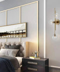 Three Light Modern Wall Sconce With Clear Glass Globe And Gold Base For Bedside Or Living Room Sleek Gold Wall Lamp Delivers Warm Ambient Glow And Contemporary Decor